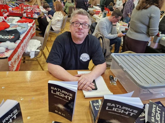 Rick Hardwick, who was signing copies of his book, 'Saturn's Light.'