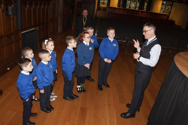 Pupils from St. Paul’s PS School Council, Slievemore, Derry, pictured with their Principal, Mr. Gareth Blackery, getting a tour of the Guildhall on Monday morning last. 