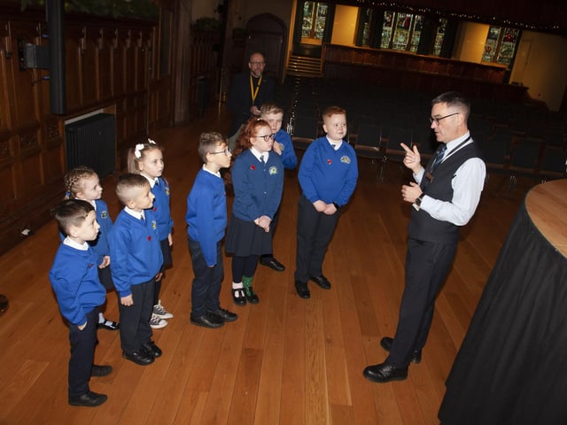 Pupils from St. Paul’s PS School Council, Slievemore, Derry, pictured with their Principal, Mr. Gareth Blackery, getting a tour of the Guildhall on Monday morning last.