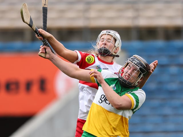 Derry's Roisin Cassidy competes in the air with Mairead Teehan of Offaly. (Photo: INPHO/Ben Brady)