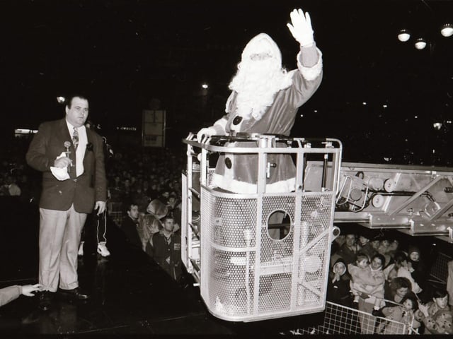 Santa, with help from TV Gladiator Falcon, also known as Bernadette Hunt, switched on the Derry Christmas lights.