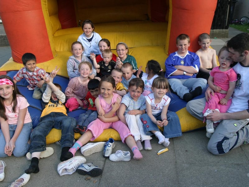 Friends together on the bouncy castle.