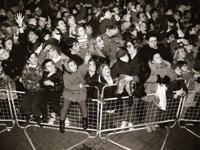Crowds watch as Mayor and Mayoress of Derry, John and Carita Kerr switch on the Christmas lights with a little help from Spider Man and the Power Rangers.