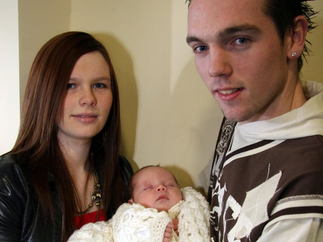 Mum Christina and dad Gerard smile for the camera with their son Gerard on the occasion of his Christening 0015JML : Parties and nights out in March 2006