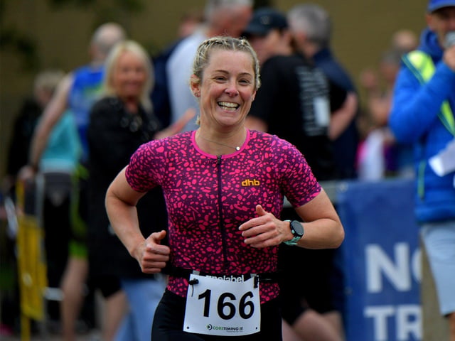 A happy Grainne Quigley takes part in the Liam Ball Triathlon on Sunday morning.