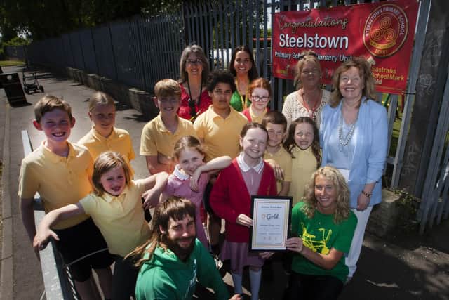GOLD FOR STEELSTOWN!. . . . . .Steelstown Primary School Eco Committee members proudly show off their Sustrans Gold School Award at the school on Wednesday morning with Stephen. Ward and Laura Cooey from Sustrans. Included at back are Mrs Sarah Brown, Miss Bronagh Lynch, Mrs Lennie Kennedy and Mrs Siobhan Gillen, Principal. (Photos: Jim McCafferty Photography)