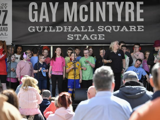 Ardnashee School choir and band play on stage, in Guildhall Square, on afternoon. Photo: George Sweeney