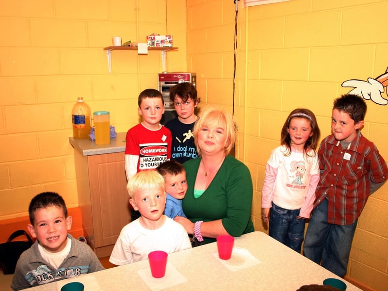 Auntie Laura surrounded by friends of Joseph having a good time at the party. 8465/dd : .