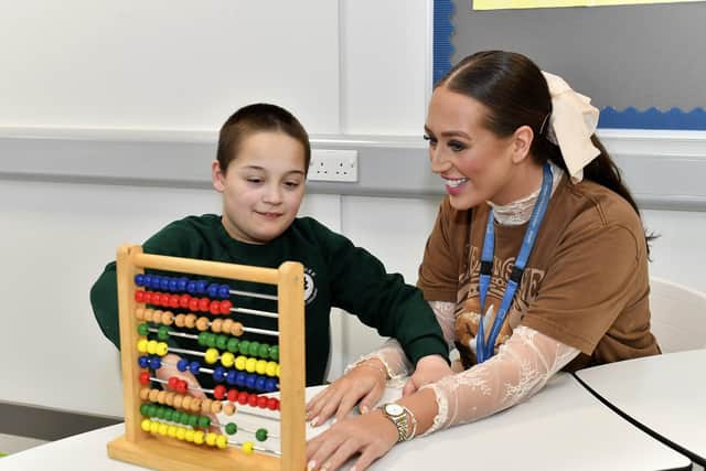 Puipil Oran Jackson with teacher Laura McLaughlin at the newly opened Ardnashee School and College Northland Academy, on Northland Road, on Monday morning. Photo: George Sweeney