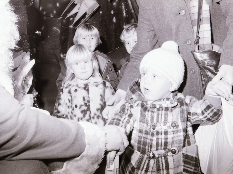 Children meeting Santa Claus at Wellworths shop in Waterloo Place.