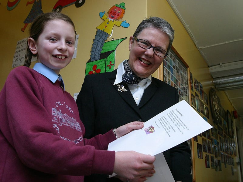 Primary 7 pupil Niamh McGuire from Culmore Primary SChool, who scooped first prize in a poetry competition organised by the Verbal Arts Centre, pictured with Zoe Reid, Verbal Arts Centre.