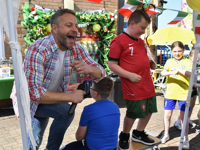 Musician and singer Richie Remo and Carter boogie during the Annual Farland Way Hazelbank Big Lunch. Photo: George Sweeney