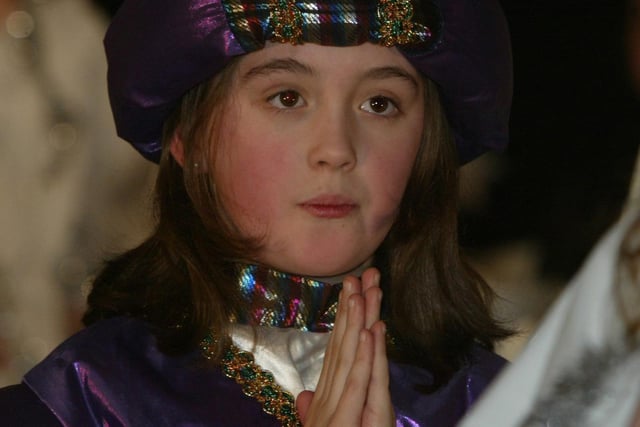 Trench road PS pupil Nicola McIntyre performing at the schools carol service in the Church of the Immaculate Conception. (1912JB02) :Derry nativities and Christmas shows from December 2003