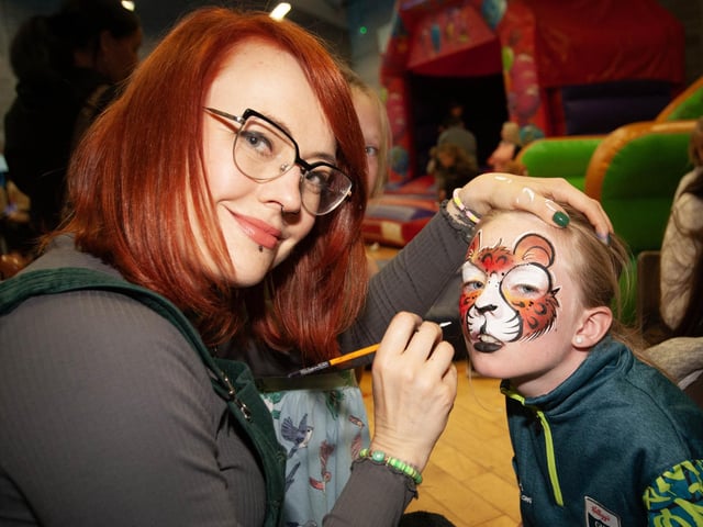 Young Blathnaid Murphy gets the finishing touches to her 'Tiger Face' on Friday night. (Photos: Jim McCafferty Photography)