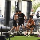 Shane O'Doherty, Daryl McDermott and Graham Doherty during the sled pull in the Ebrington Hyrox on Saturday morning. Photo: George Sweeney