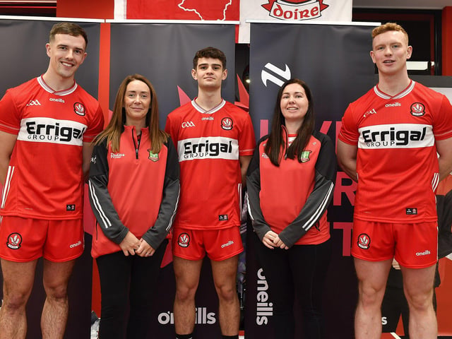 Sinead Wilson and Emma Lynch pictured with county players John Mullan, Patrick McGurk and Marty Bradley at the launch of Derry’s new home and away jersey, for the 2026/2027 season, at O’Neill’s sports store in Waterloo Place on Thursday evening. Photo: George Sweeney