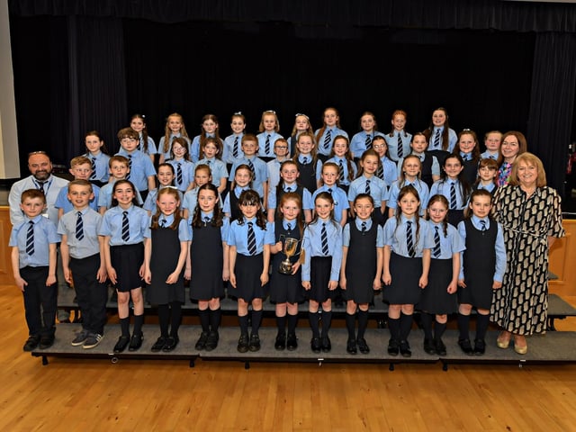 Hollybush Primary School claimed third place in the UNISON Choir category at the Feis Dhoire Cholmcille Choral Competitions held in St Mary’s College. Included in the photograph (from left) are Acting Principal Feargal Friel Mrs Leona Matthews and Mrs Yvonne Bradley. Photo: George Sweeney