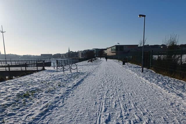 Snowfall along the quay in January.