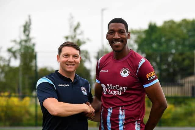 Institute's new signing Brandon Diau pictured with team manager Kevin Deery. Photo: George Sweeney