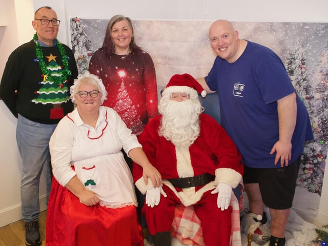 Staff with Santa and Mrs Claus, from left to right – Mark Leach, Clare-Ellen Duddy, and Brian Hasson.