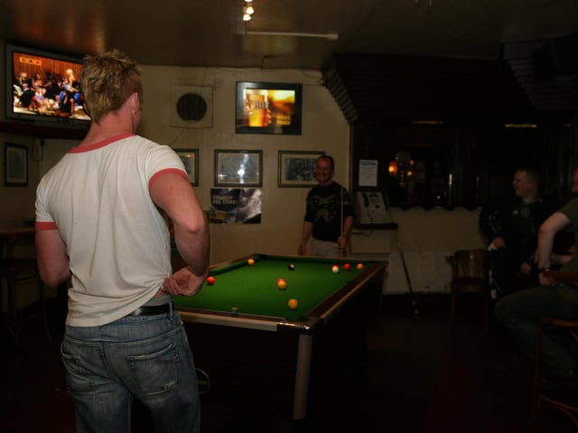 Customers playing pool in the Bogside Inn back in June 2004.