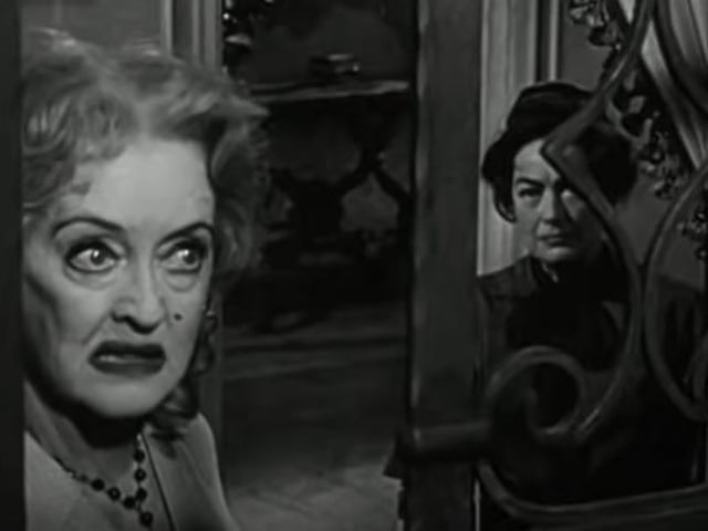 WHATEVER HAPPENED TO BABY JANE? (1962) Two of the most iconic actors of Hollywood's golden era in their later years, a sterling script and superb direction and makeup doesn't come close to explaining just why Whatever Happened to Baby Jane? is such a phenomenal film. More suspense than outright horror, this is a psychological drama that focuses on two spinster sisters who were former actors, with jealousy, rivalry, abusive behaviour and dependency all explored in detail with incredible performances by Bette Davis (Jane) and Joan Crawford (Blanche). This cinematic masterpiece, directed by Robert Aldrich and based on a novel by Henry Farrell just builds and builds and gets better with each mud-slinging scene. Memorable scene: The macabre child actor relived routine. (Image: YouTube)