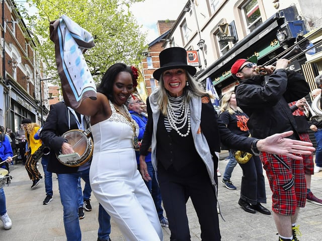 Mayor Lilian Seenoi Barr and Angela,vocalist with Angela and her NOLA Brass Squad, lead the Jazz Festival's DLD Second Line Parade on Saturday morning. Photo: George Sweeney