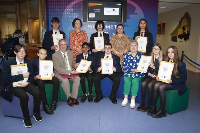 Class 10D, pictured after receiving theri MEE Graduation awards at Oakgrove Integrated College on Tuesday morning last. Included are Mr. John Harkin, Principal, Marie Dunn, Resilio, and at back, Ms. Aislinn Breslin, and Mrs. Judith Colvin, MEE teachers. 
