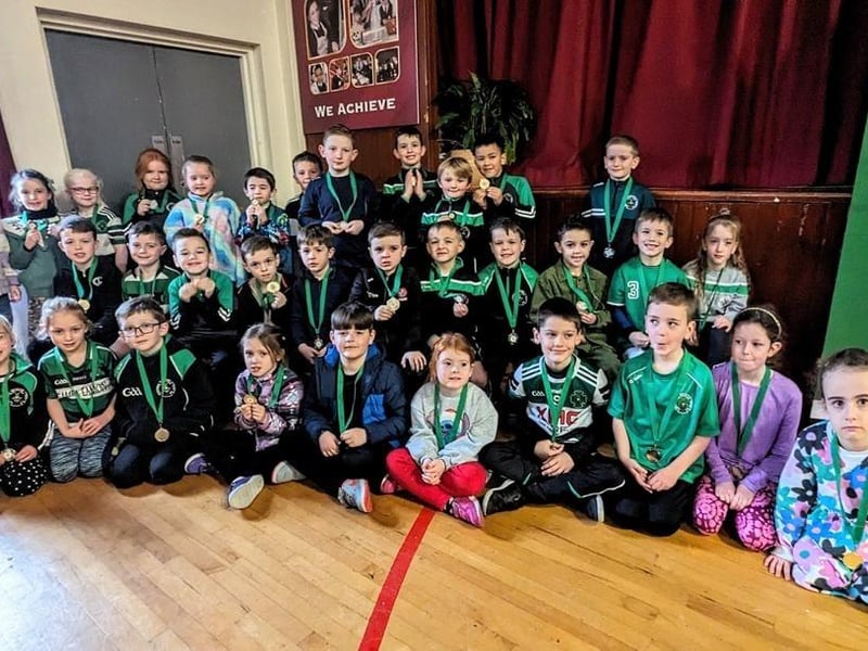 These youngsters proudly get their photograph taken with their medals at Na Magha's annual awards night.