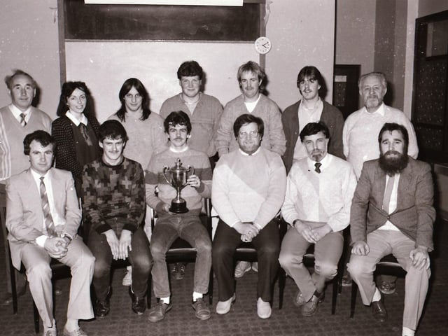 Group pictured at a prize presentation in 1986.