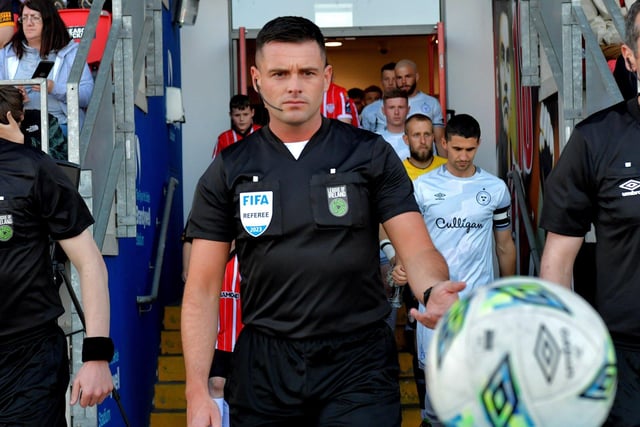 FIFA referee Rob Hennessy leads out the Derry City and Shelbourne teams for the big game in the Ryan McBride Brandywell Stadium. Photo: George Sweeney. DER2321GS - 82