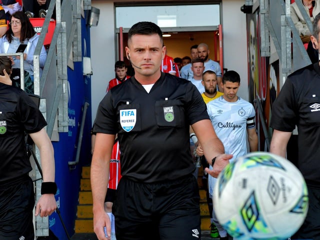 FIFA referee Rob Hennessy leads out the Derry City and Shelbourne teams for the big game in the Ryan McBride Brandywell Stadium. Photo: George Sweeney. DER2321GS - 82