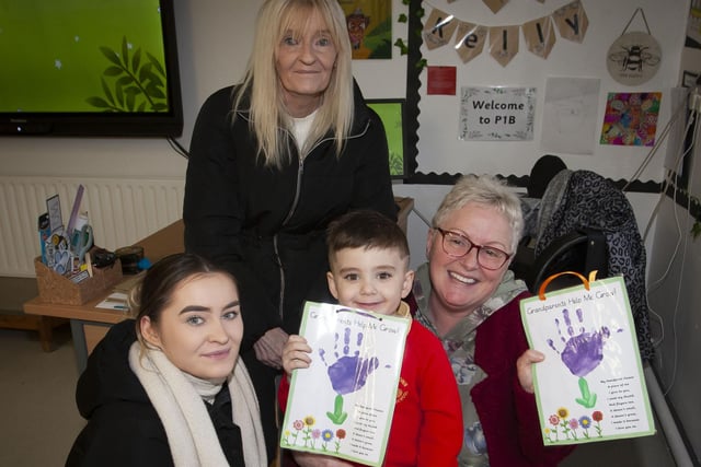 Nursery pupil Marcus pictured with his mum and grannies on Wednesday.