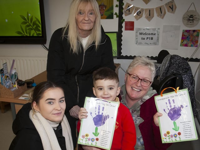 Nursery pupil Marcus pictured with his mum and grannies on Wednesday.