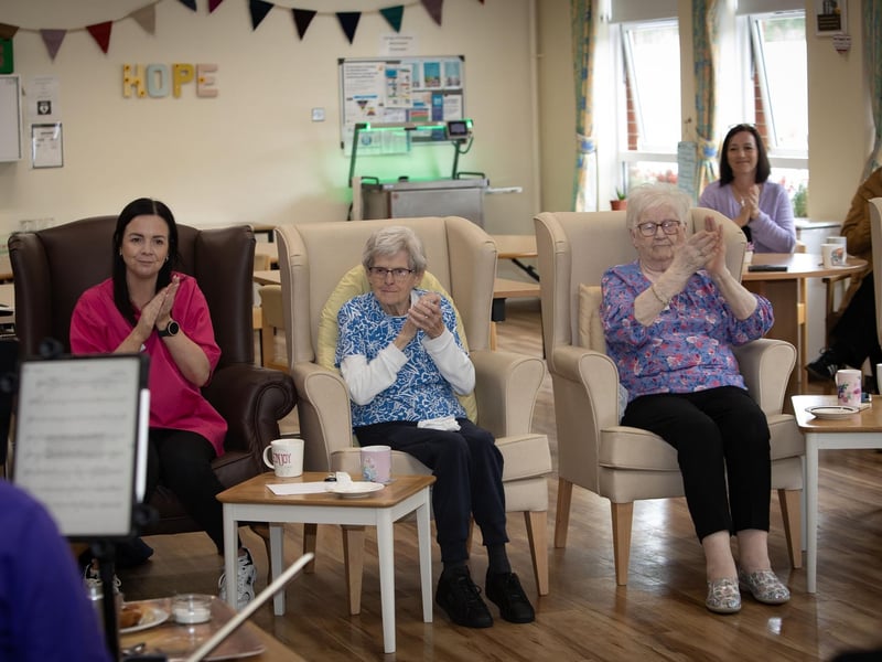 Residents and staff at the Creggan Day Centre applauding members of the Ulster Orchestra who performed at the centre on Tuesday morning last as part of Féile 24. (Photos: JIm McCafferty Photography)