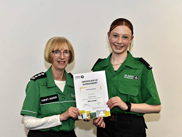 Hanna McGahey receives the Best First Aider award from Denise McDaid, leader, at the St John’s Ambulance Belmont Awards evening held in the SJA Hub, Skeoge Industrial Estate. Photo: George Sweeney