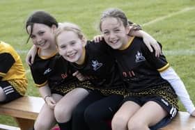 Three of the young footballers from Glendermott Primary School pictured on Wednesday.