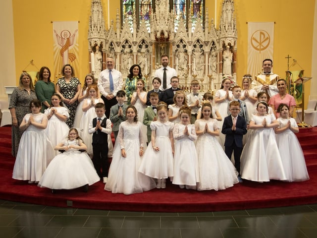 Pupils from Oakgrove PS, Lisnagelvin PS and Ebrington PS who received the Sacrament of First Holy Communion from Fr. Patrick Lagan at St. Columb's Church, Chapel Road on Thursday afternoon last. Included are principals and teachers from the three schools. (Photo: Jim McCafferty Photography)