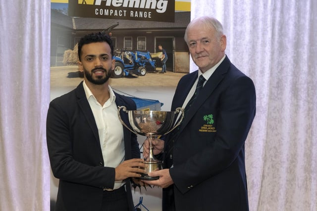 Ardmore Cricket Club's Rachit Gaur, who also won the Premiership batting award, receives the 'Radio Foyle Player of the Year' trophy from Cricket Ireland President, William Wilson.