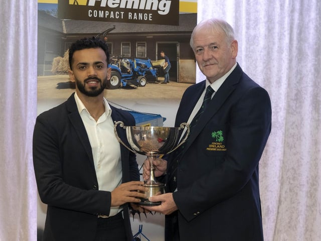 Ardmore Cricket Club's Rachit Gaur, who also won the Premiership batting award, receives the 'Radio Foyle Player of the Year' trophy from Cricket Ireland President, William Wilson.