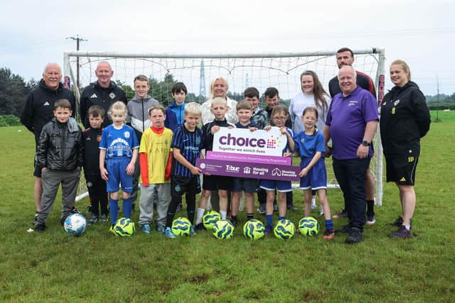 Pictured (L-R) are coaches Joe Doherty and Seamus Heath, Joanne McGowan (Choice Housing Officer), Patrick McClean (City of Derry Football Club), Mark Kent (Choice Good Relations Officer) and Coach Rosie McColgan. They are joined by young people from Rosses Gate.