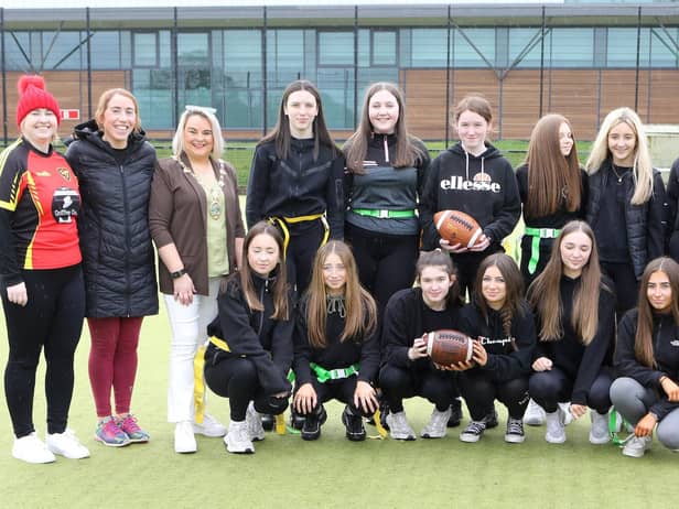 Mayor Sandra Duffy with pupils from Hollycross College who had a go at American football at the Mayor's Sporting event for women/girls schools held in the Foyle Arena. Included on left, are Anna McBeth, Vipers coach, Siobhan Garry, PE teacher, and on right, Peter Hamilton, Vipers coach, and Christiane Hunter, PE teacher. (Photo - Tom Heaney, nwpresspics)