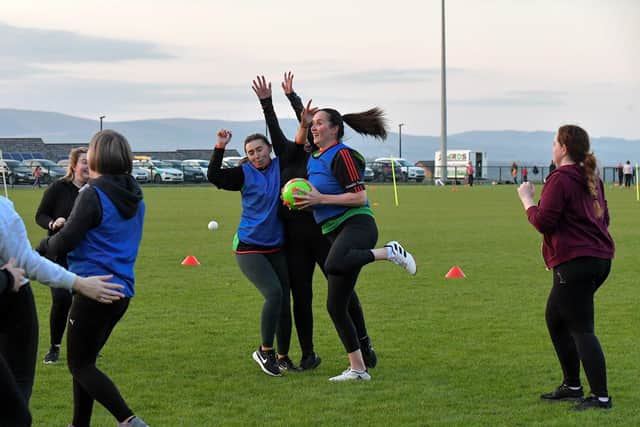 Action from Doire Trasna’s first Mothers and Others football practice session, at Corrody Road. Photo: George Sweeney. DER2316GS – 20