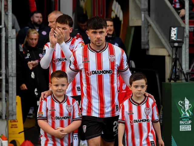 Mascots pictured with Derry City’s Adam O’Reilly at the game against Shelbourne. Photograph: George Sweeney