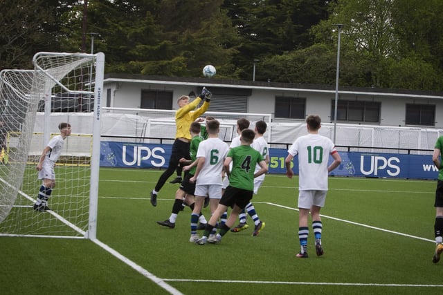 Grosvenor College goalkeeper Watson Kingham clears this danger from a St. Joseph’s corner on Friday.