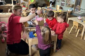 Little Explorers enjoy sensory play together.