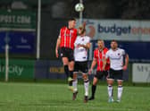 Derry skipper Patrick McEleney wins this header against Dundalk's Greg Sloggett. Photo: Kevin Moore