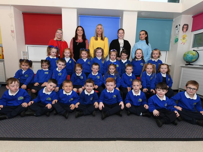 Mrs Logue, second from left, pictured with her P1 class and classroom assistants at St Paul’s Primary School.