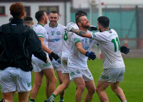 Craigbane’s players Brian Rainey and Cahir O'Kane celebrate their Junior Football Championship final defeat of Ballerin at Celtic Park on Sunday afternoon last.  Photo: George Sweeney.  DER2241GS – 38