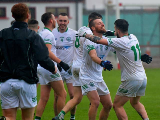 Craigbane’s players Brian Rainey and Cahir O'Kane celebrate their Junior Football Championship final defeat of Ballerin at Celtic Park on Sunday afternoon last.  Photo: George Sweeney.  DER2241GS – 38